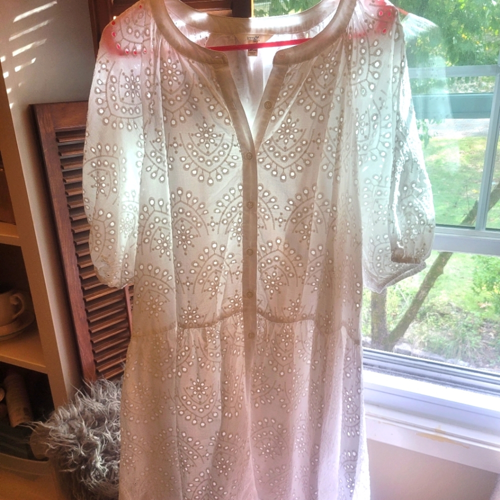 Adorable white lacey dress.